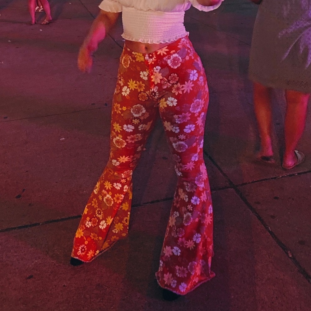 Orange bell bottom pants with floral pattern. Brand: Altar’d State. Size: medium